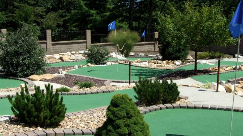 A nice looking mini golf course in Sarasota with trees and rocks and clean greens
